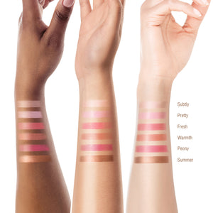 Three arms with different skin tones displaying makeup swatches on a white background. Shades featured Subtly, Pretty, Fresh, Warmth, Peony, Summer