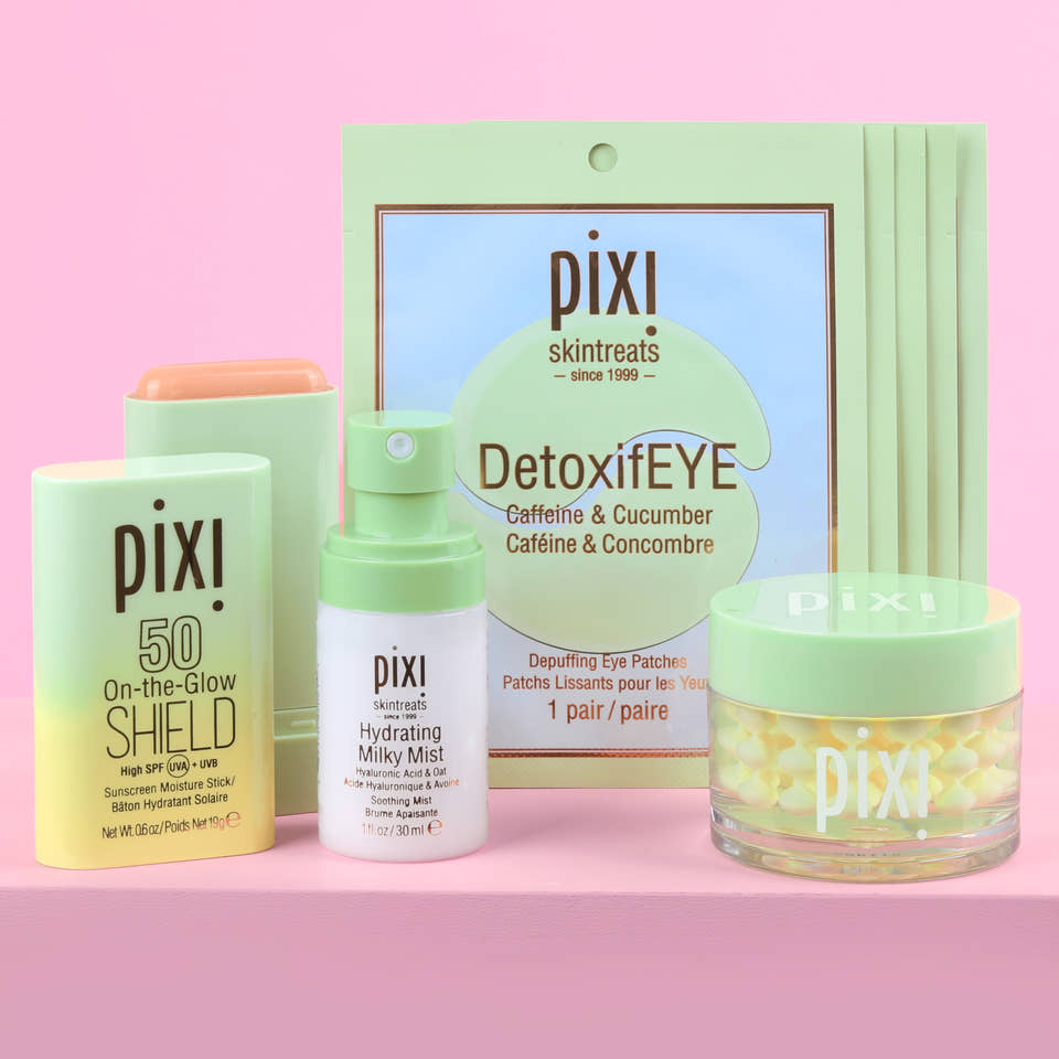 Petra's Travel Glow bundle includes Hydrating Milky Mist, DetoxifEYE Depuffing Eye Patches 5 pair, On-the-Glow SHIELD SPF 50, Vitamin-C CremeSerum on pink background. view 1