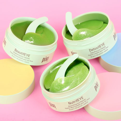 Three jars of Pixi eye patches on a pink background - BeautifEYE, DetoxifEYE and NutrifEYE shown. view 1