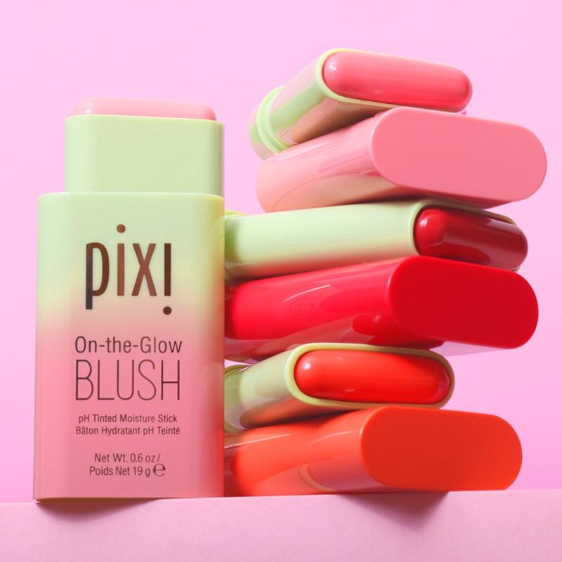 Pixi On-the-Glow Blush sticks in assorted colors against a pink background view 2