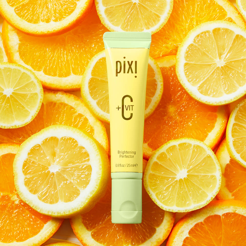 +C Vit Brightening Perfector with a background of oranges view 1