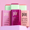 3 shades of On-the-Glow Blush shown with open lids on a pink background